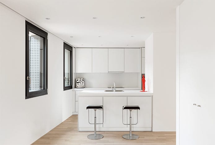 Black Art Stools in All White Kitchen