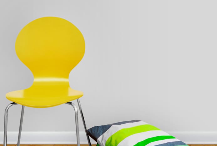 Candy Dining Chair Yellow Next To A Grey Wall