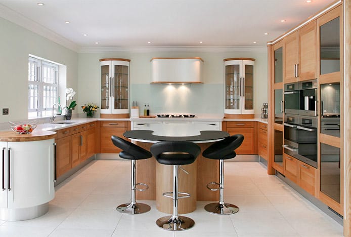 Padded Crescent Stools At Circular Kitchen Island