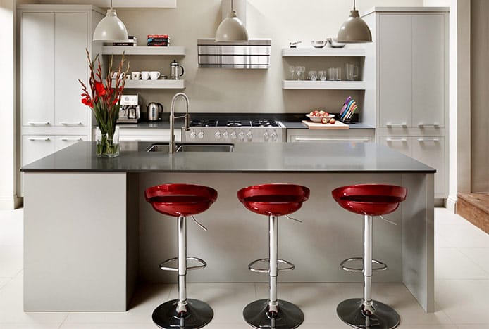 Red Crescent Stools in Cream Kitchen