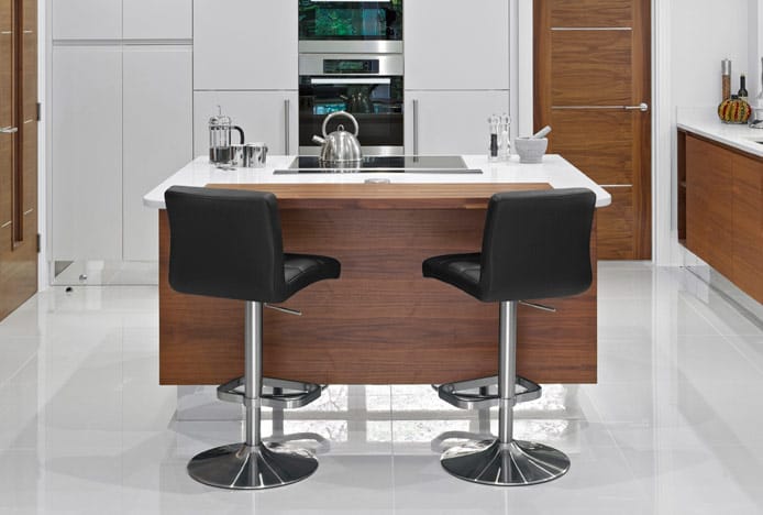 Lush Brushed Steel Bar Stools Set At An Angle